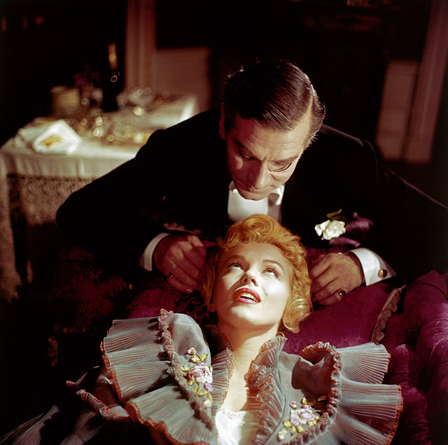 Marilyn Monroe looks up at Laurence Olivier on the set of 'The Prince and the Showgirl' in 1956.