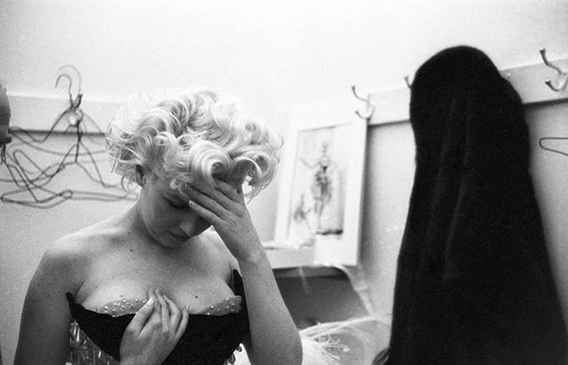 This photo captures a moment of frustration during a costume fitting, 1955