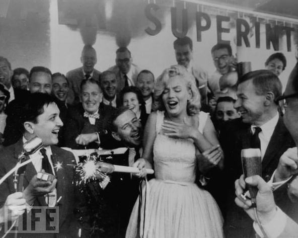 Marilyn Monroe helps get the festivities underway during a ceremony for the soon-to-be-built Time & Life Building in New York, 1957