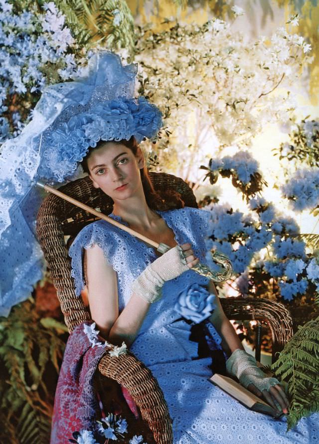 Carmen Dell' Orefice in white eyelet dress by Sophie of Saks Fifth Avenue, hat by Tatiana du Plessix, 1946.