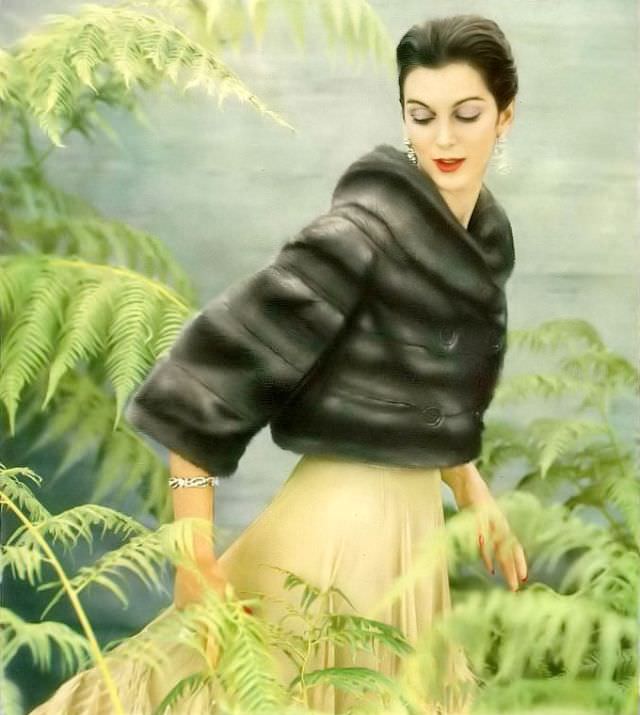 Carmen in an Emba mink jacket by Maximilian, dress by Jane Derby and jewels by Cartier, 1956.