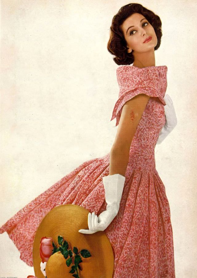 Carmen in peony-pink silk print dress with fichu-collar by Galanos, hat by Emme, 1956.