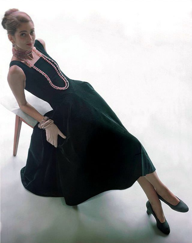 Carmen Dell' Orefice in green velvet dress, glass bead necklace and bracelet by Lisner, pumps by Capezio, gloves by Kislav, 1947.