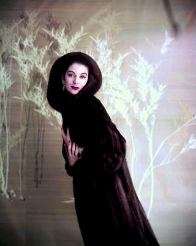 Carmen in a dark hooded mink coat, 1957.