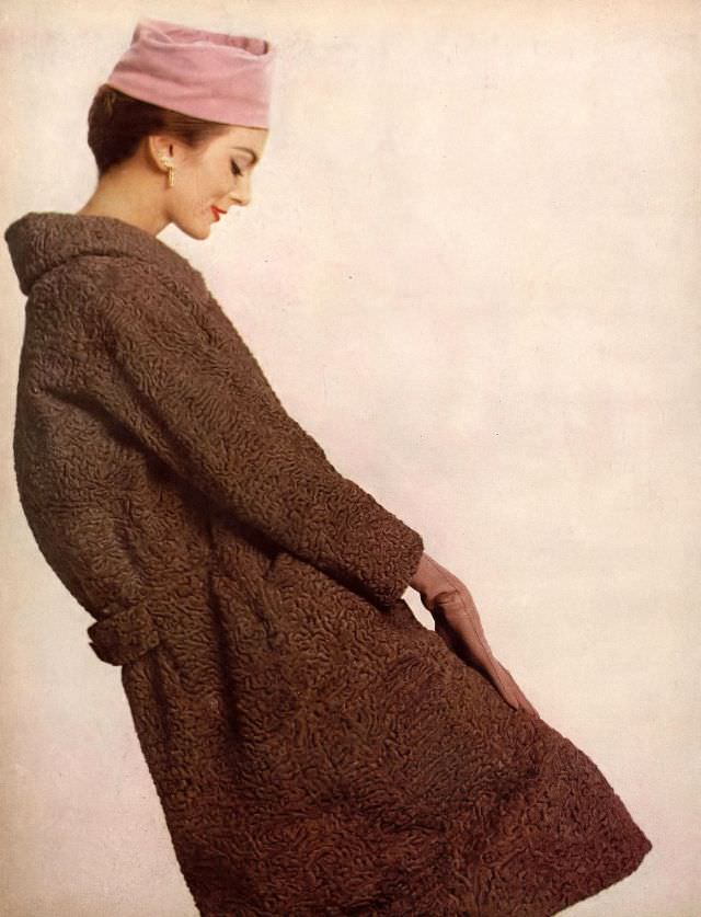 Carmen in mocha-colored Persian lamb walking coat by Schiaparelli, hat by Mr. Arnold, jewelry by Verdura, 1958.