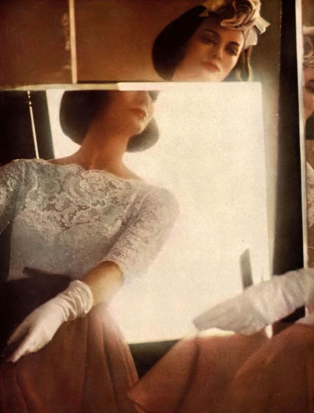 Carmen in white lace top over yards of brown chiffon by Harvey Berin, dinner hat of roses by Dior-New York,  1959.