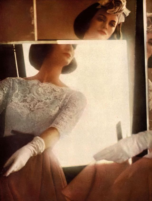 Carmen in white lace top over yards of brown chiffon by Harvey Berin, dinner hat of roses by Dior-New York, 1959.