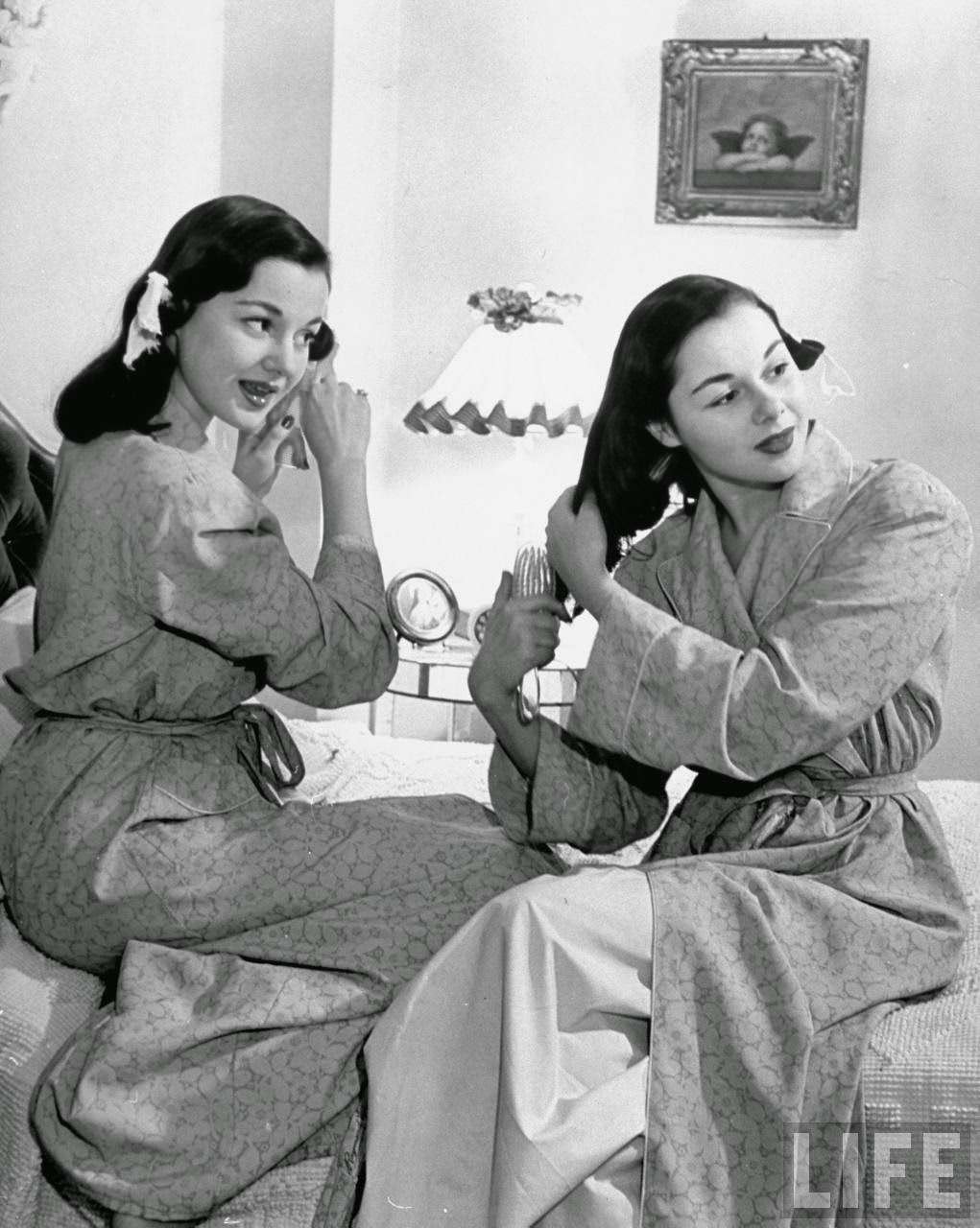 The O'Connor twins Gloria and Consuelo, setting their hair, 1947