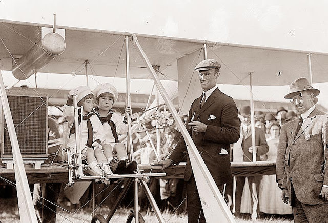 Twins getting ready for an airplane flight, 1910