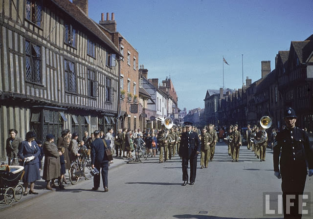 US Army band leading a procession during birthday celebrations honoring William Shakespeare.