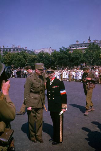 Free French General and military governor of the French capital Pierre Koenig, left, pictured during ceremonies held the day after the liberation of Paris, August 1944