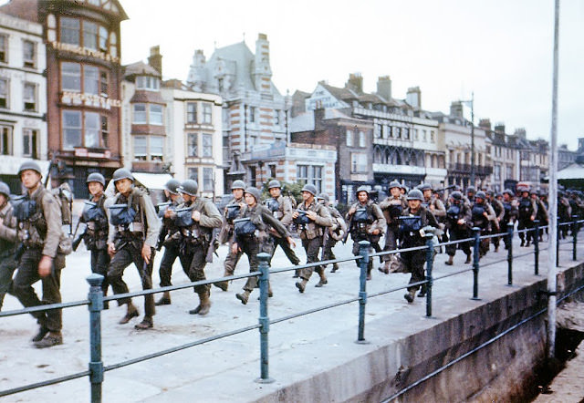 US troops on the Esplanade at Weymouth, Dorset, on their way to embark on ships bound for Omaha Beach for the D-Day landings in Normandy, June 1944.