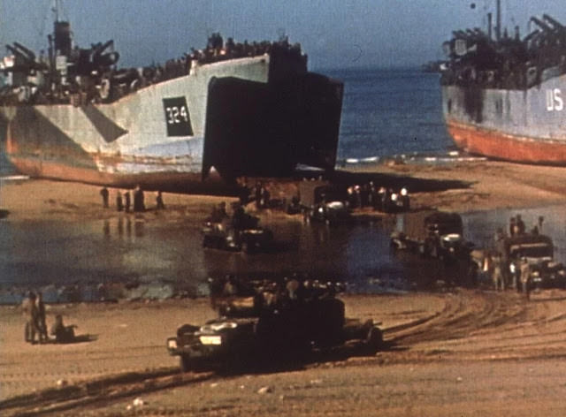 Operation Overlord - On a pebble beach at Omaha Beach U.S. soldiers deal with injuries.