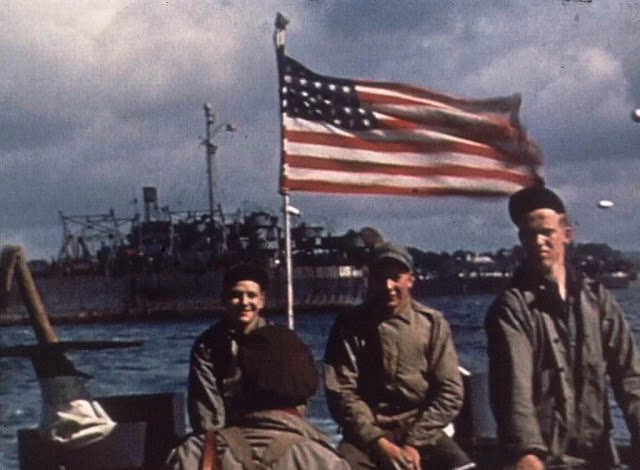 US troops travel the English Channel on a barge en route to Normandy, France for the D-Day Invasion.