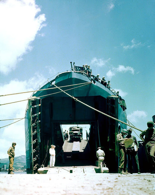 Operation Overlord Normandy, A United States truck is entering a Landing Craft Tank (LCT) in a port in Southern England.