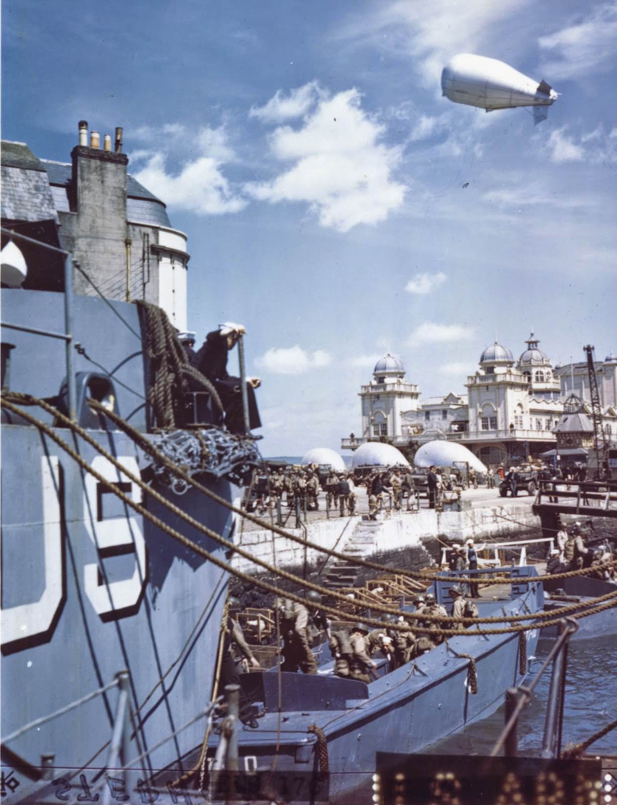 American troops at a British port descend into barges which will take them to troop ships from which they will launch the attack against Hitler’s Fortress Europe.