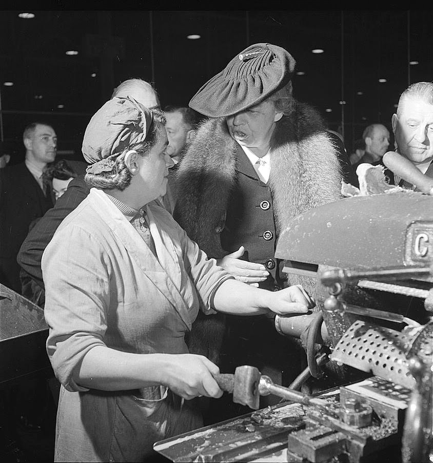Eleanor Roosevelt talking with woman machinist during her goodwill tour of Great Britain, 1942.