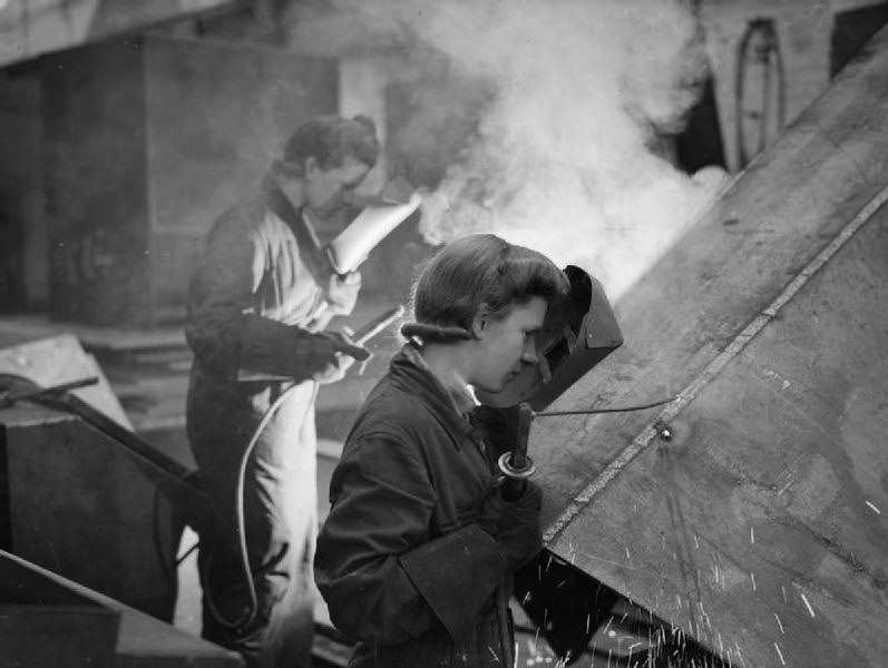 Shipbuilding: Female welders at work on a merchant ship at Greenock, 1945.