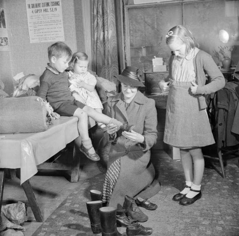 Women's voluntary service run Children's Clothing Exchange, Norwood, London, 1943.