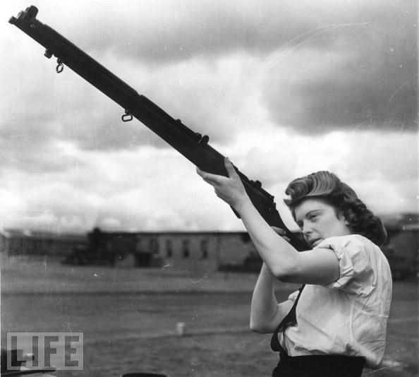 Some 72,000 women would join the Wrens (Women's Royal Naval Service), freeing British sailors for combat duty by taking on home front jobs, like this Wren, an armorer at a Scottish Royal Air Force Base.