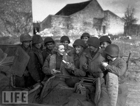 Servicemen, like these GIs in Germany in early 1945, adored Marlene Dietrich, and openly admired her fearlessness when visiting troops far from the safety of Hollywood.