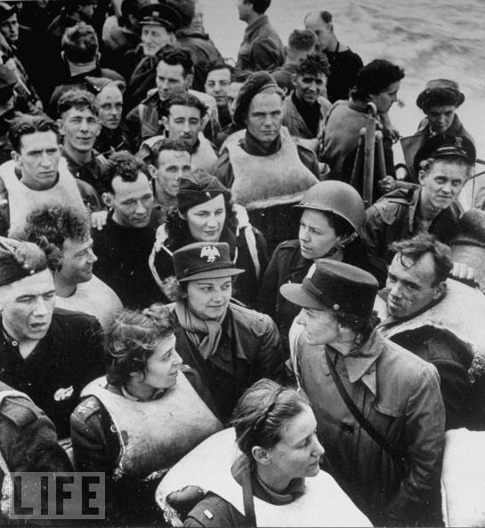 WAC officers and other survivors on board a rescue destroyer after their transport ship was torpedoed in the ocean near North Africa.