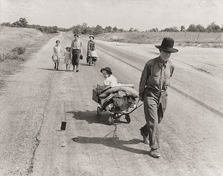 Family walking on highway, five children, 1936