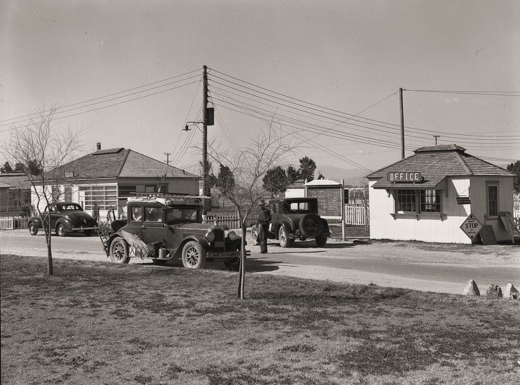 Entering Farm Security Administration (FSA) camp for migratory laborers at Indio. Coachella Valley, California