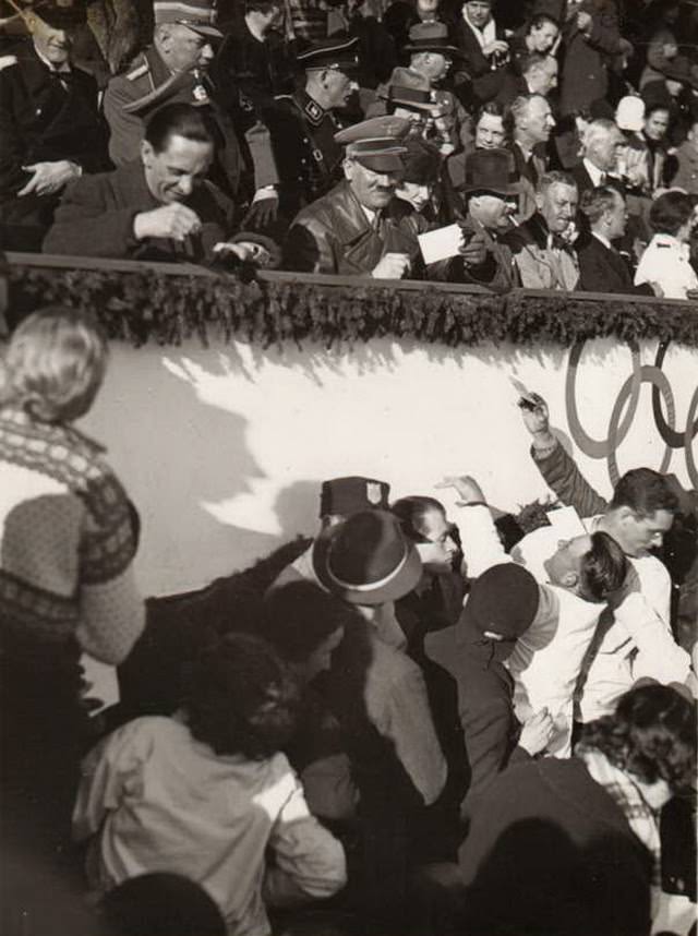 Adolf Hitler and Joseph Goebbels signing autographs at the 1936 Olympics