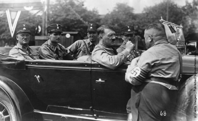 Adolf Hitler with his companions. (Left – Right) Graf, Hess, Schant, Hitler, Sleinbinder and Christian Weber, 1929