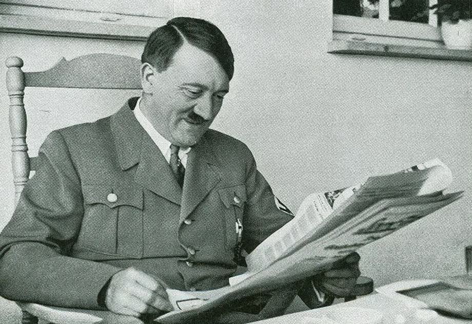 Hitler reading a newspaper