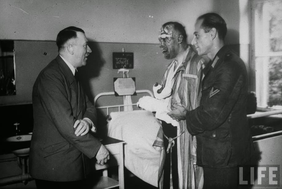 Hitler comes to visit one of the injured officers, after a failed assassination attempt on Hitler, July 20, 1944