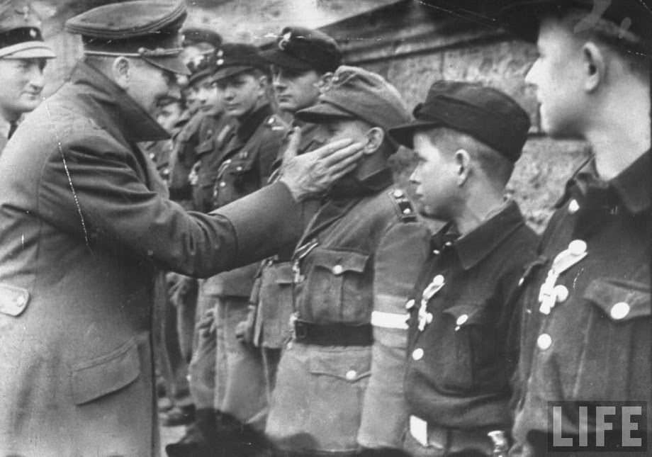 One of the last photo of Hitler. The Fuhrer in the garden of the Reich Chancellery awards the young members of the Hitlerjugend (Hitler Youth) brigade mobilized to defend Berlin