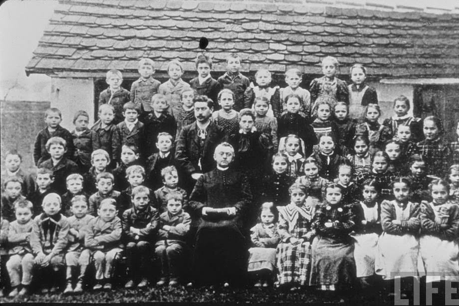 Little Hitler (third from the left on the bottom row) with classmates, Fischlham, Austria-Hungary, 1895