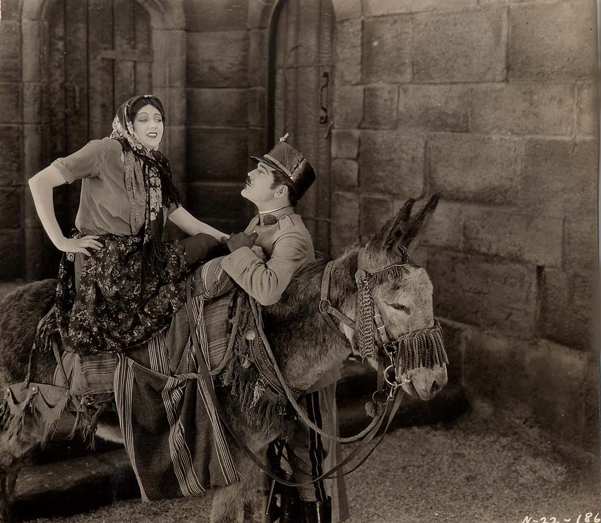 Barbara La Marr with Wallace MacDonald in "Thy Name Is Woman", 1924