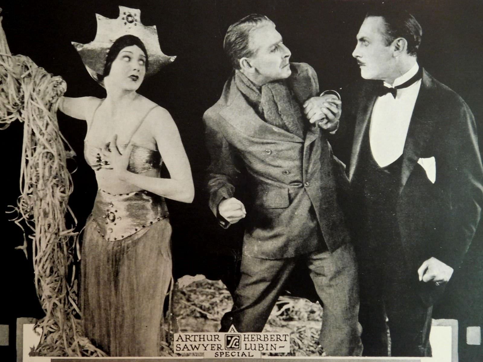 Barbara La Marr with Percy Marmont (center), and Lew Cody (on right) in "The Shooting of Dan McGrew", 1924