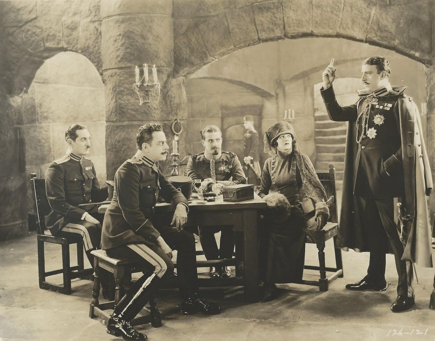 Barbara La Marr in "The Prisoner of Zenda", 1922 with Stuart Holmes (standing) as Black Michael, and Ramon Novarro (seated, center) as Rupert of Hentzau