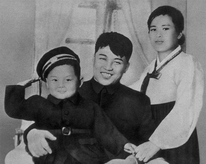 Kim Jong-il with his father, Kim Il-sung, and his mother Kim Jong-suk in 1945