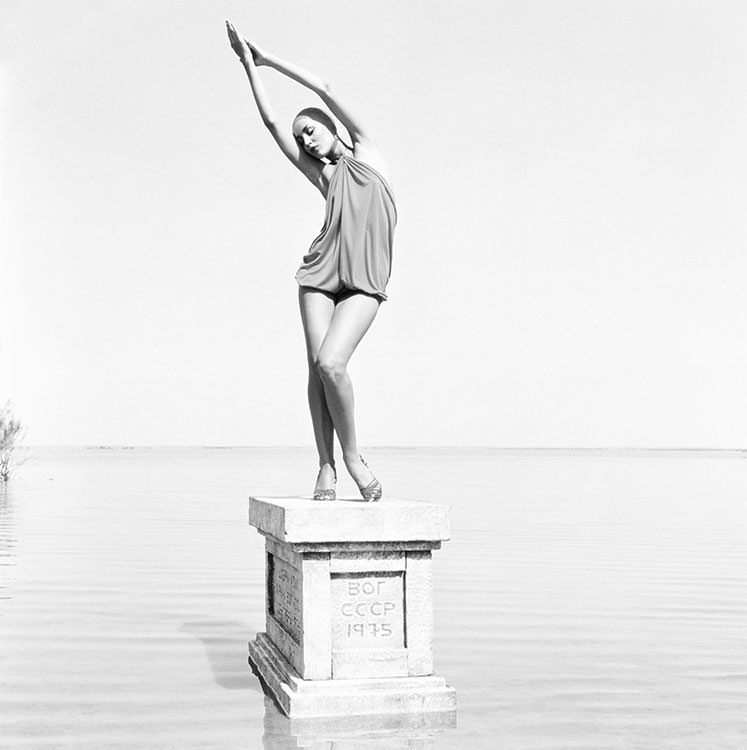 Jerry Hall poses on a plinth on the shore of Lake Sevan in Armenia, 1975
