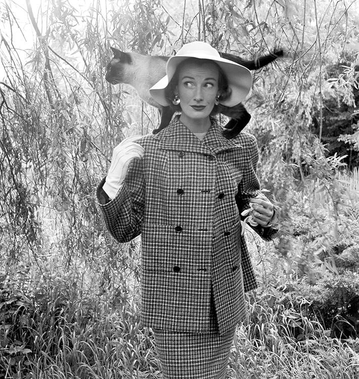 Wenda Parkinson with a cat on her shoulders, 1951