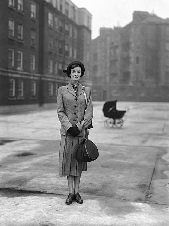 Wenda Parkinson wearing a Simpson’s suit at the Peabody Trust Buildings, Fulham Road, London, 1950