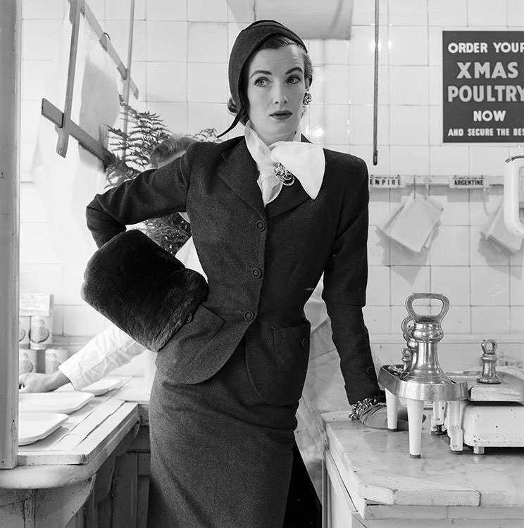 Wenda Parkinson in a classic suit in clerical grey and flannel hat, 1954