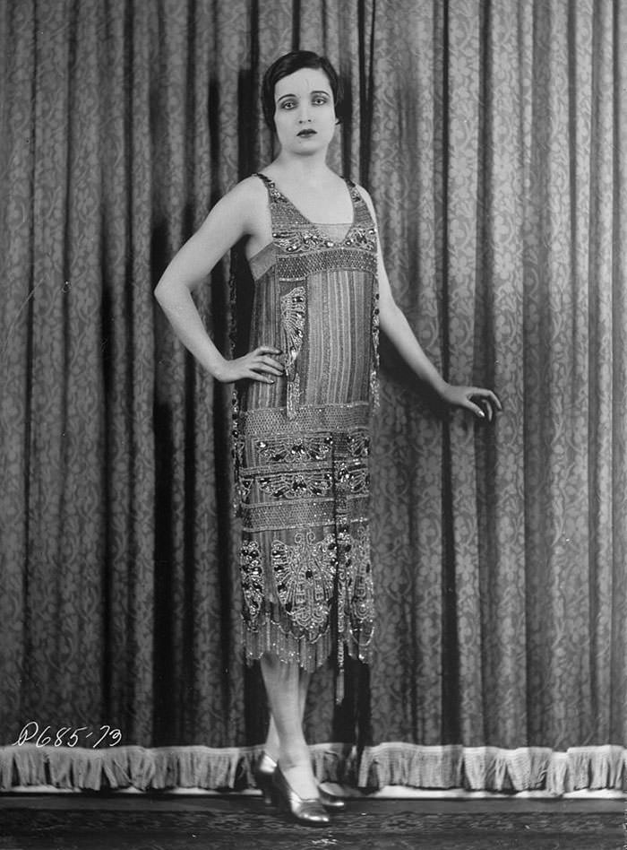 Actress Alice Joyce in a straight dress with a sheer beaded overdress, 1926