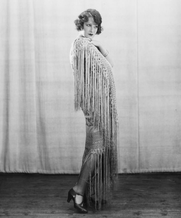 A Glamorous Brunette Wearing a Matching Fringed Wrap and Dress, 1928