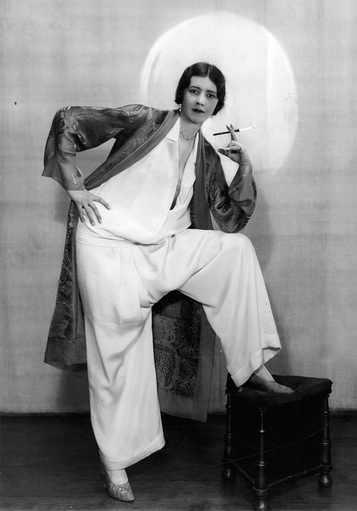 Woman wearing culottes and smoking, 1928