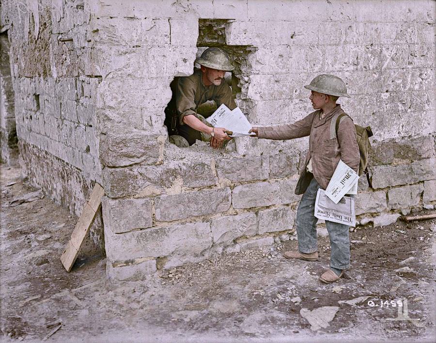 A little french paper boy selling papers in Canadian line, June 1917