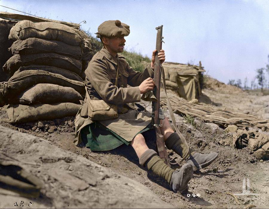 Highlander cleaning his rifle, June 1961