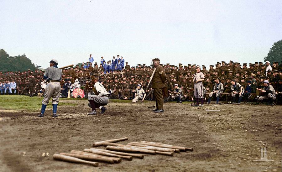 Baseball game with bats in foreground and crowd of CEF Members in background watching . Sept 1917