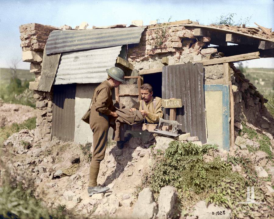 A Canadian About to go on leave taking his tunic to the tailor’s shop for, September 1917
