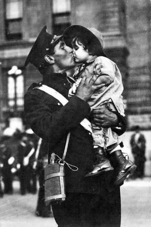 Canadian soldier kisses his daughter goodbye before going off to war, 1914.